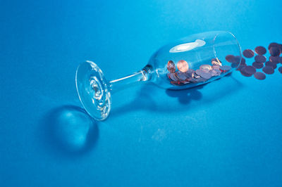 Close-up of ring on table against blue background