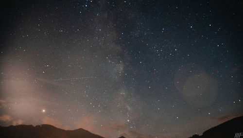 Low angle view of star field against sky at night
