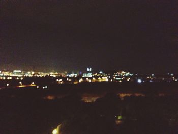 Illuminated cityscape at night