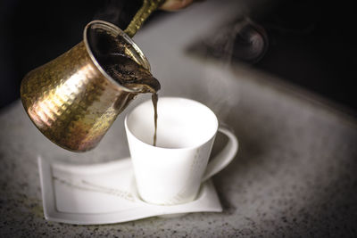 Close-up of coffee cup on table