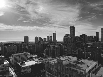 High angle view of buildings in city against sky