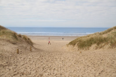 Scenic view of beach against sky