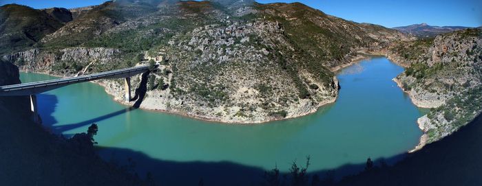 Scenic view of lake and mountains against sky