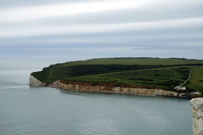 Scenic view of sea against cloudy sky