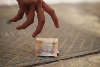 Close-up of hands on floor