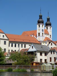 View of buildings against blue sky