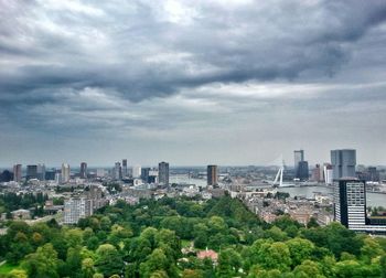 Cityscape against cloudy sky