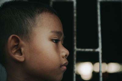 Close-up portrait of boy looking away