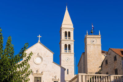 Low angle view of church against clear blue sky