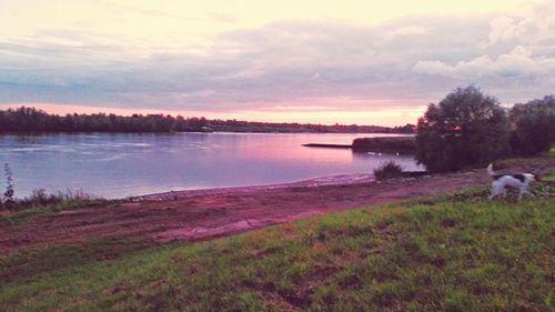 Scenic view of lake against sky during sunset