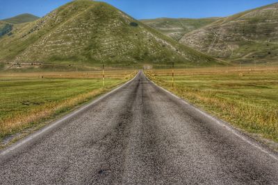 Road leading towards mountains