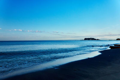 Scenic view of sea against blue sky