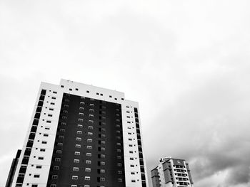 Low angle view of modern buildings against sky