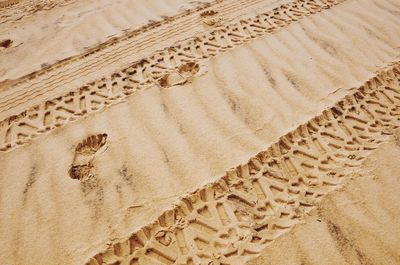 High angle view of text on sand