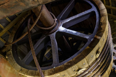 High angle view of old rusty wheel