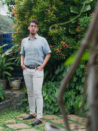 Rear view of man standing in forest