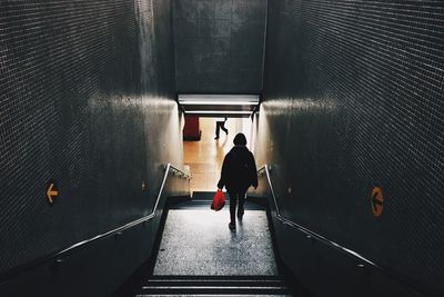 Woman walking in tunnel