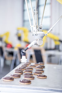 Close-up of industrial robot handling cookies