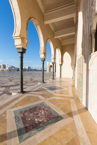 Corridor of historic building against sky