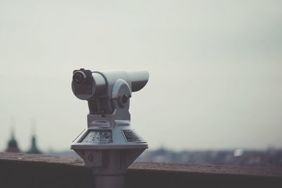 Close-up of coin-operated binoculars against clear sky