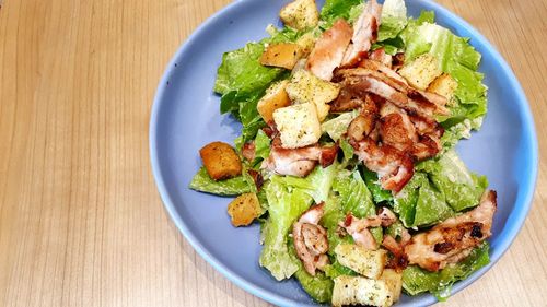 High angle view of vegetables in plate on table