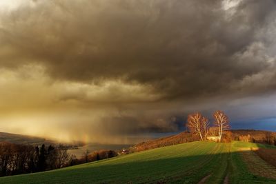 Scenic view of storm clouds over land