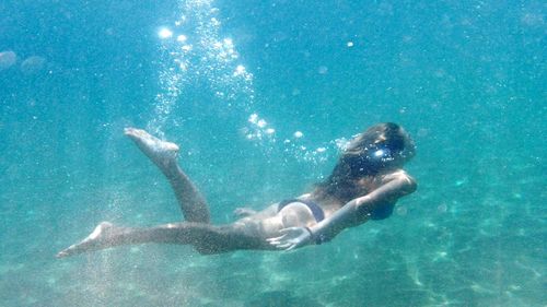 Full length of woman swimming in sea