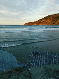 Scenic view of sea against cloudy sky