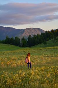 Full length of woman on field against sky