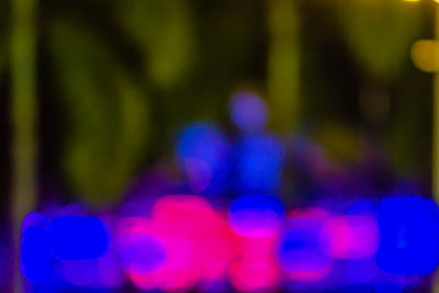 Defocused image of illuminated lights at night
