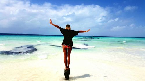 Woman standing on beach