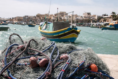 Fishing boats moored at harbor