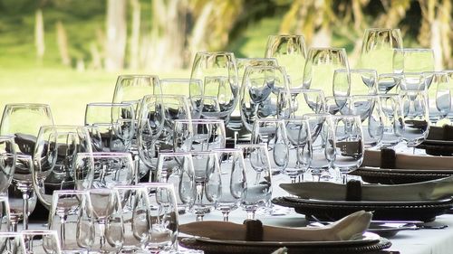 Wineglasses and plate arranged on table