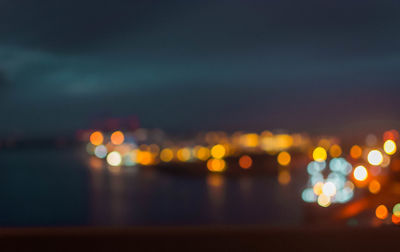 Defocused image of illuminated city at night