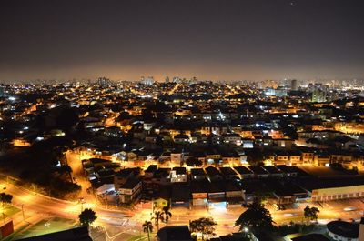 Aerial view of illuminated cityscape at night