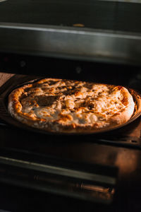 Close-up of pizza on cutting board