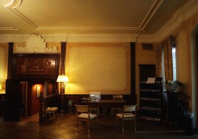Empty chairs and tables in restaurant