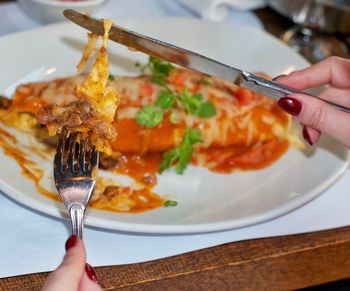 Cropped image of person holding food