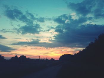 Scenic view of silhouette landscape against sky at sunset