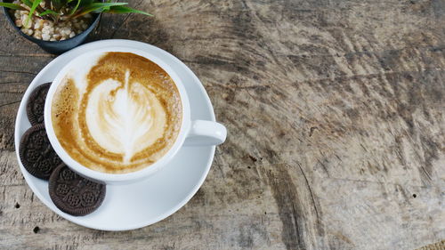 High angle view of cappuccino on table