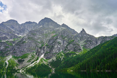 Mountains range near beautiful lake. tatra national park in poland. morskie oko or sea eye lake