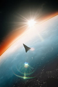 Spaceship orbiting around earth at dawn. mission to mars.