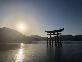 Scenic view of lake against sky during sunset