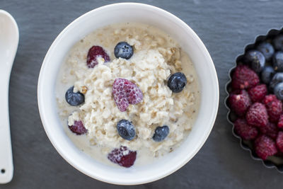 Close-up of fruits and oatmeal in bowl