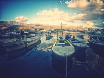 Boats moored at harbor