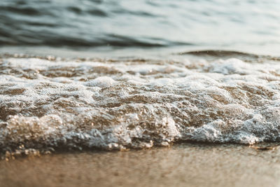 Close-up of waves rushing towards shore