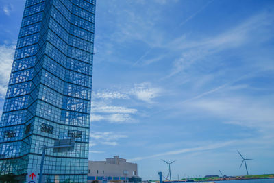 Low angle view of skyscraper against sky