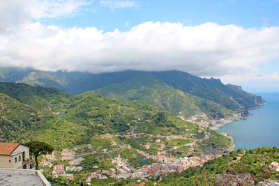 Scenic view of mountains against cloudy sky