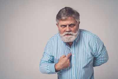 Portrait of man against white background