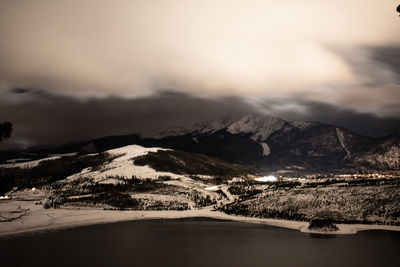 Scenic view of snowcapped mountains against sky during winter